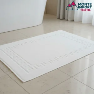Alfombrín de baño blanco de algodón y poliéster con textura absorbente